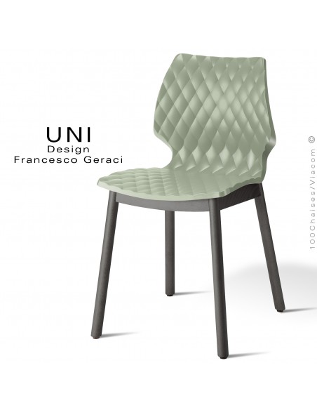 Chaise UNI, piétement bois teinté noir, assise coque effet matelassé couleur vert pistache.