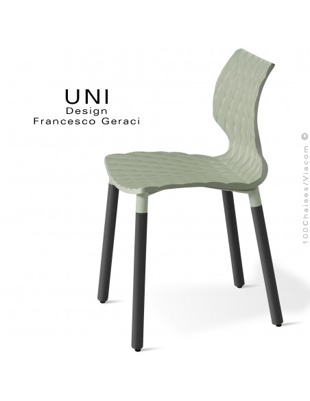 Chaise UNI, piétement bois de hêtre rond, vernis noir. Assise coque plastique effet matelassé couleur vert pistache.