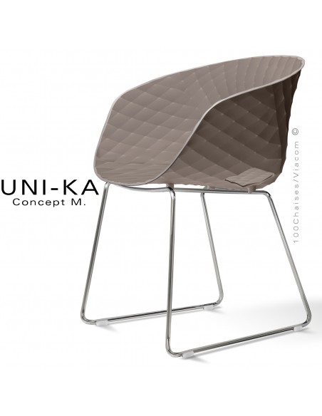 Fauteuil design UNIKA, coque plastique couleur argile effet matelassé, piétement luge chromé brillant.